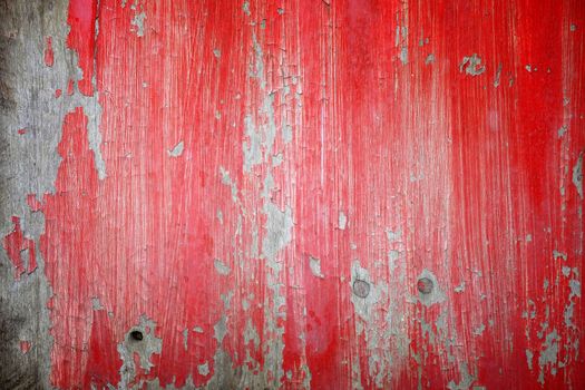 Red Peeling Paint on Old Wooden Wall Background.