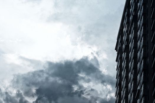 New Condominium Building with Cloudy Day Background.