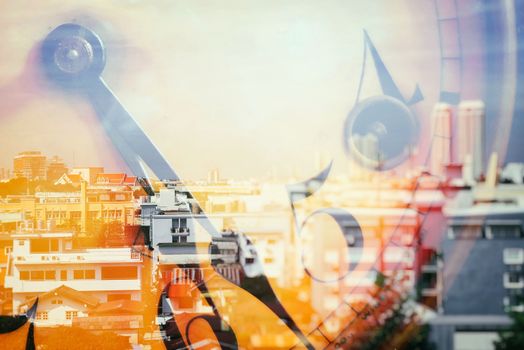 Double Exposure of Cityscape with Old Vintage Clock.