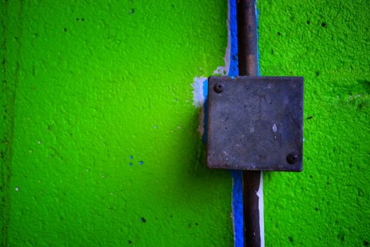 Electrical Box on Green Concrete Wall.
