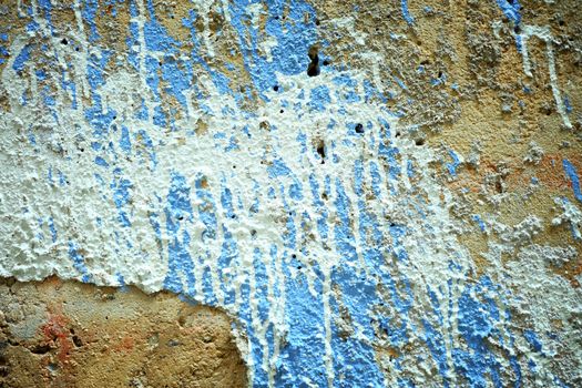 White and Blue Painting on Grunge Concrete Wall Background.