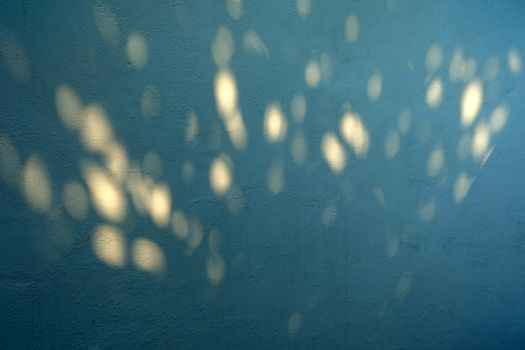 Shadow and Light Bokeh on Concrete Wall Background.