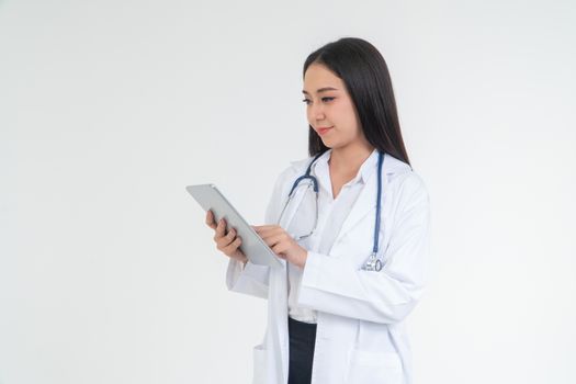 Female  Doctor or physician holding a tablet for checking patient health in hospital, Concept of online healthcare information and emergency healthcare assistance service, Medical service