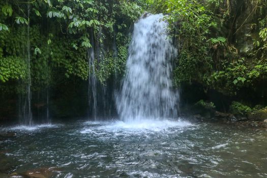Yeh Ho Waterfall is located in the lush rice field-laden Penebel village in Tabanan. Waterfall near to Jatiluwih rice terrace in Bali, Indonesia. Beautiful waterfall in deep tropical jungle.