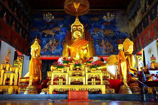 Ancient Golden Buddha image in main hall at Wat Nang Chee Bangkok Thailand.