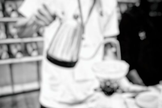 Blurred Barista Making Coffee in Coffee Shop.