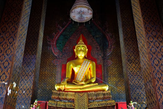 Ancient Golden Buddha image in main hall at Wat Intharam Temple Bangkok Thailand.