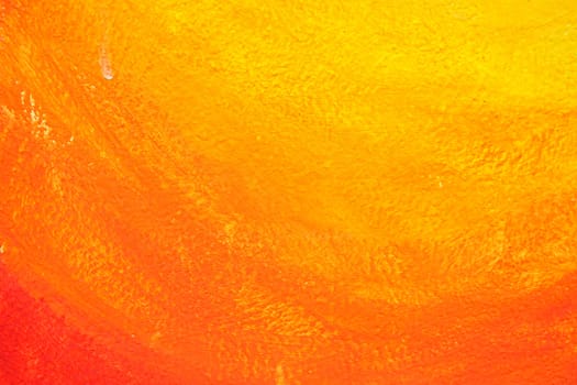 Unfinished Orange Painting on Concrete Background.