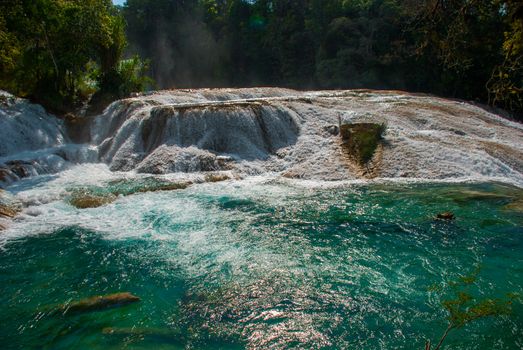 Amazing Turquoise-blue water of the waterfall Agua Azul in Chiapas, Palenque, Mexico. Beautiful scenery and view of the waterfall.