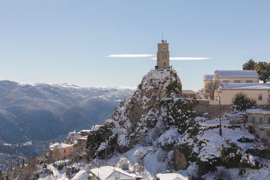 ARAHOVA, GREECE - JANUARY 6, 2019: Arahova village covered with snow in a sunny day 