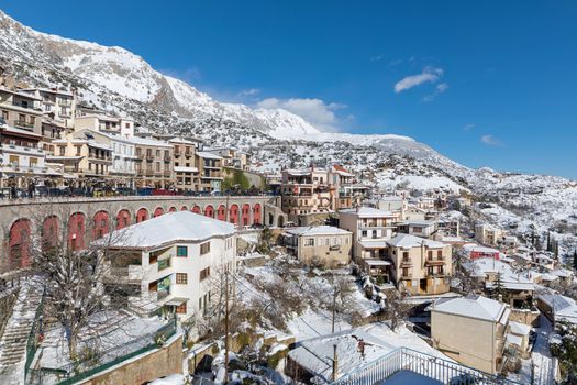 ARAHOVA, GREECE - JANUARY 6, 2019: Arahova village covered with snow in a sunny day 