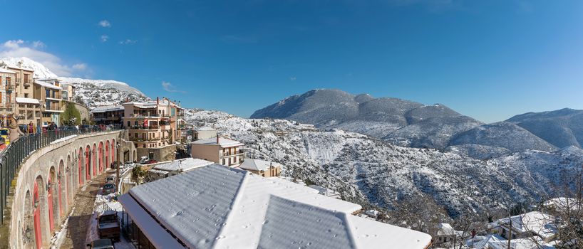 ARAHOVA, GREECE - JANUARY 6, 2019: Arahova village covered with snow in a sunny day 