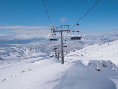 Ski lift on the slope of Parnassos ski resort in Greece