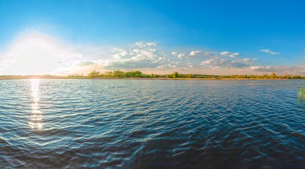 Panoramic view of the Kamenka river in the Zhytomyr region of Ukraine. Beautiful landscape of a large blue pond