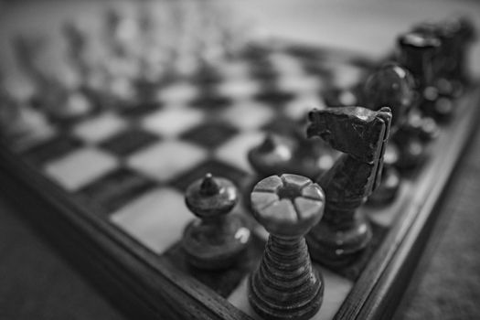 A close up of a chess board and it's pieces