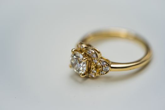 A close up of a beautiful gold diamond engagement ring