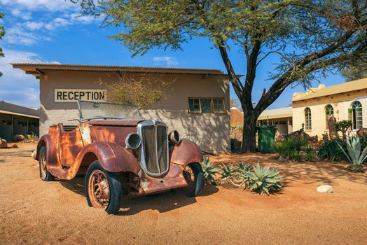 Solitaire, Namibia - March 29, 2019 : Car wreck at the Solitaire Lodge in Namibia. Solitaire is a small settlement in the namibian desert near the Namib-Naukluft National Park.