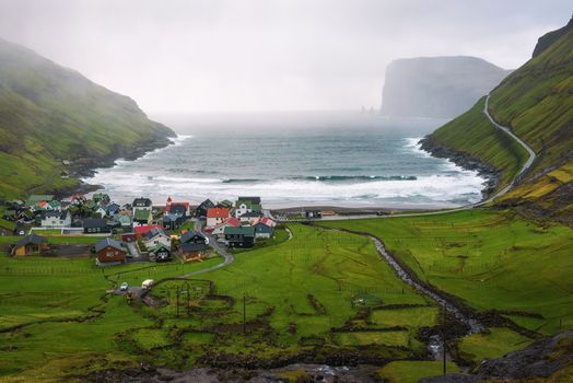 Village of Tjornuvik located on the coast of a beautiful bay in the Faroe Islands, Denmark.