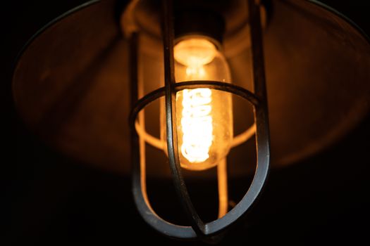 A traditional Edison style pendant light fitting suspended from ceiling