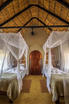 Otjovasandu, Namibia - March 30, 2019 : Chalet interior of the Hobatere Lodge in Otjovasandu. This desert lodge is located near the Galton Gate of Etosha National Park. Hdr processed.