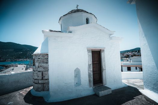 A traditional white painted church in Greece