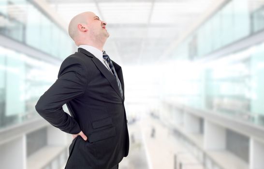 businessman with strong back pain, at the office