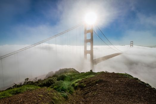 High angle view of California Golden Gate Bridge in morning fog at sunrise