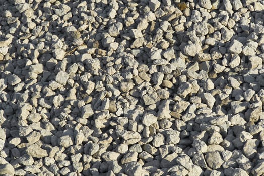 large crushed stone texture. Small pebble stones on construction site. gravel pebble stones background