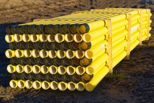 yellow plastic pipes for laying electricity cables underground