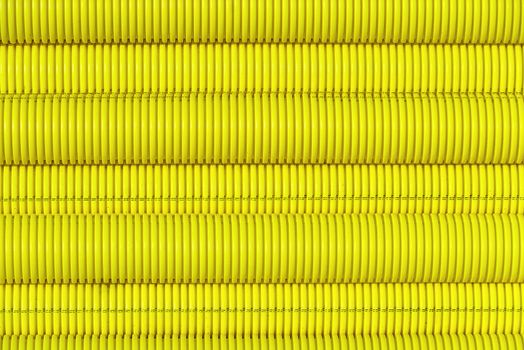 yellow plastic pipes for laying electricity cables underground. texture or abstract background