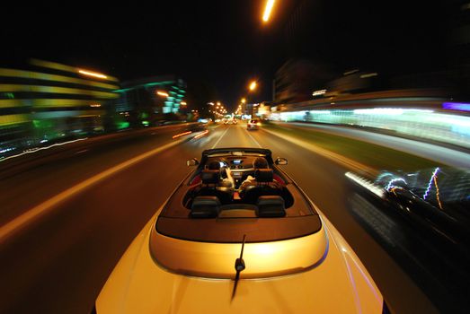 night driving a convertible with the top down