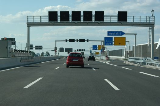 traffic signs on the highway at an intersection