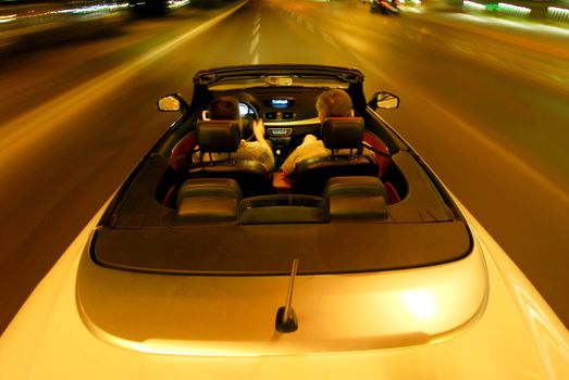 night driving a convertible with the top down