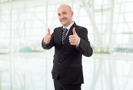 happy business man going thumb up, at the office