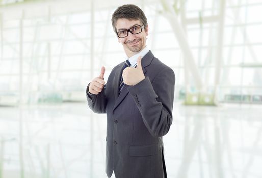 young business man going thumb up, at the office