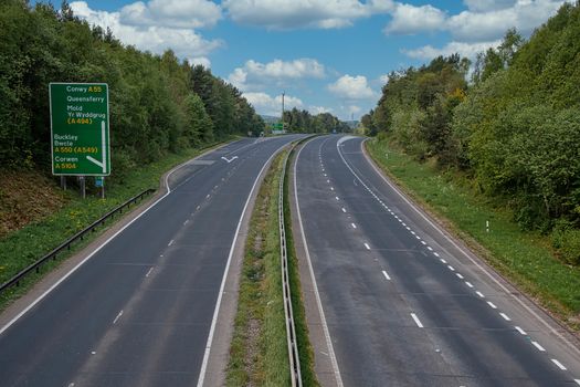 A deserted normally busy main road. The A55 is the main route from England to North Wales, normally full of traffic