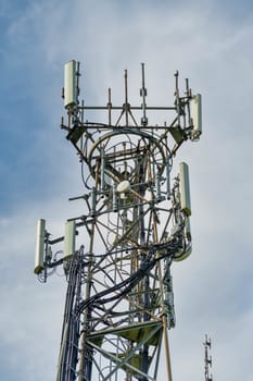 Directional mobile phone antenna aerials at the top of a mast