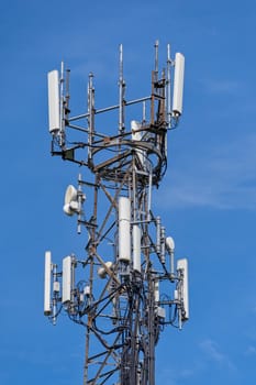 Directional mobile phone antenna aerials at the top of a mast