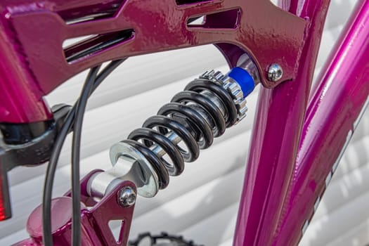 A close view of a bicycle rear suspension spring