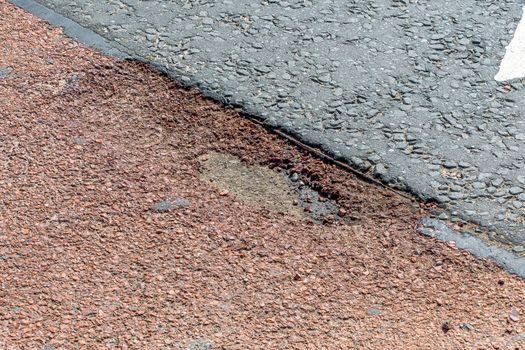 Small pothole which has developed in a road