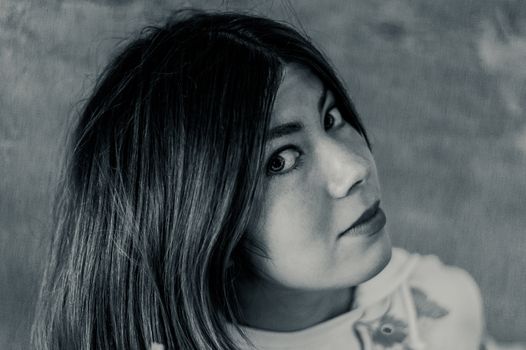 black and white portrait of a pretty black-haired girl in white