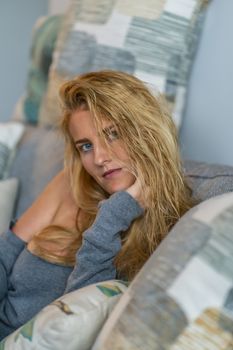 A gorgeous blonde model enjoys a day at home before work