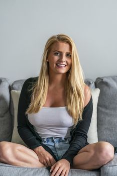 A gorgeous blonde model enjoys a day at home before work