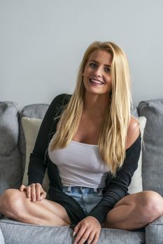 A gorgeous blonde model enjoys a day at home before work