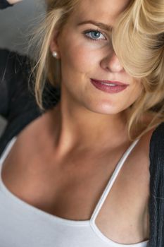 A gorgeous blonde model enjoys a day at home before work