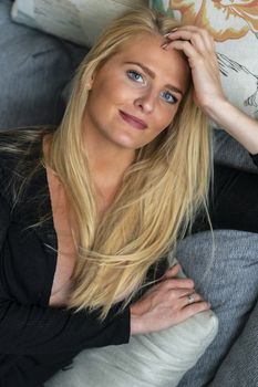 A gorgeous blonde model enjoys a day at home before work