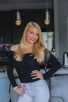 A gorgeous blonde model enjoys a day at home before work