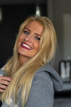 A gorgeous blonde model enjoys a day at home before work