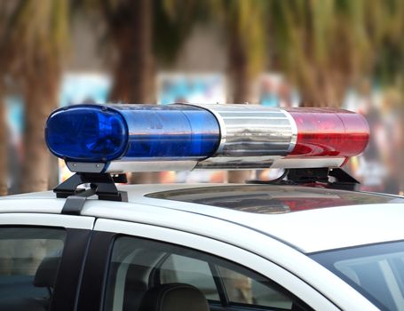 The roof-mounted lightbar of an emergency vehicle
