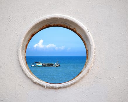 Porthole view of a Chinese fishing boat on the East China Sea
